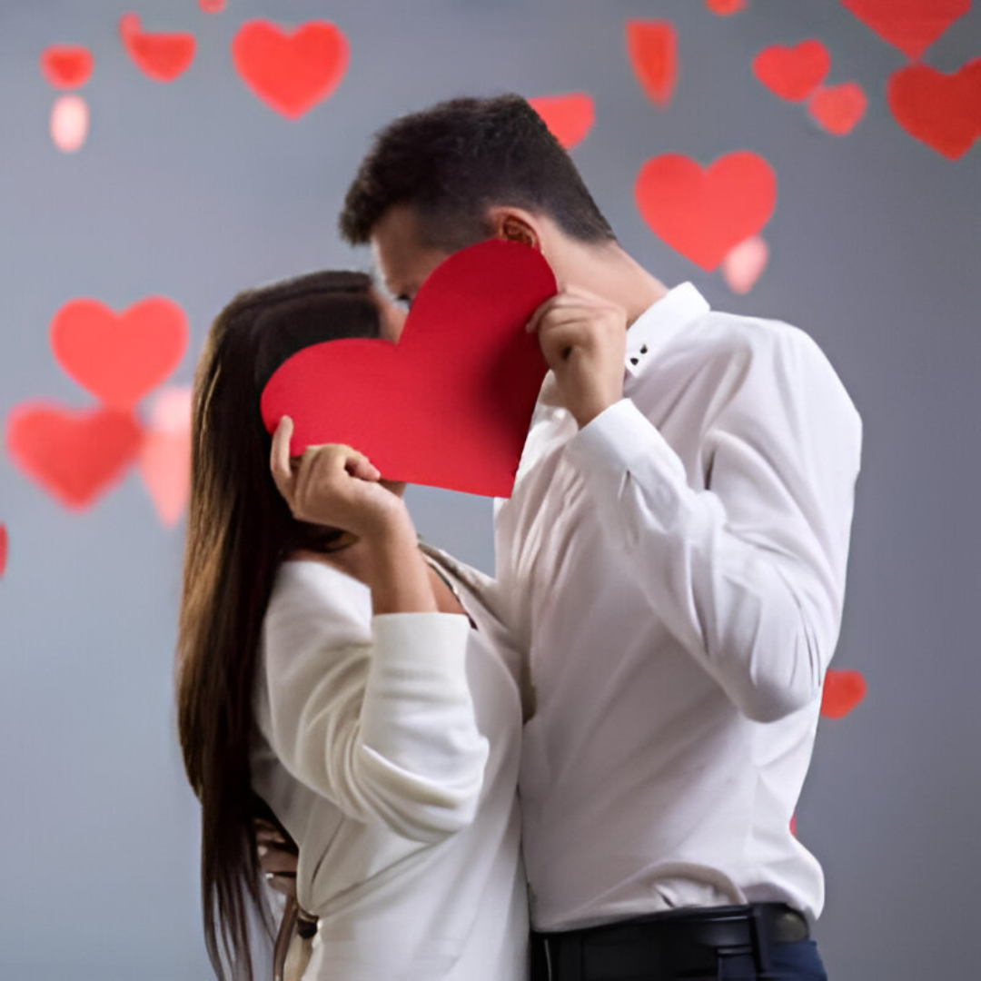 Couple holding hands at sunset